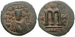 monnaie_bronze_fals arabo-byzantin-http://www.identification-numismatique.com/t1335-fals-arabo-byzantin-omeyyade-frappee-a-homs-emese